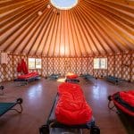 student sleeping area inside a yurt at threepeaks a nature based resedential treatment center