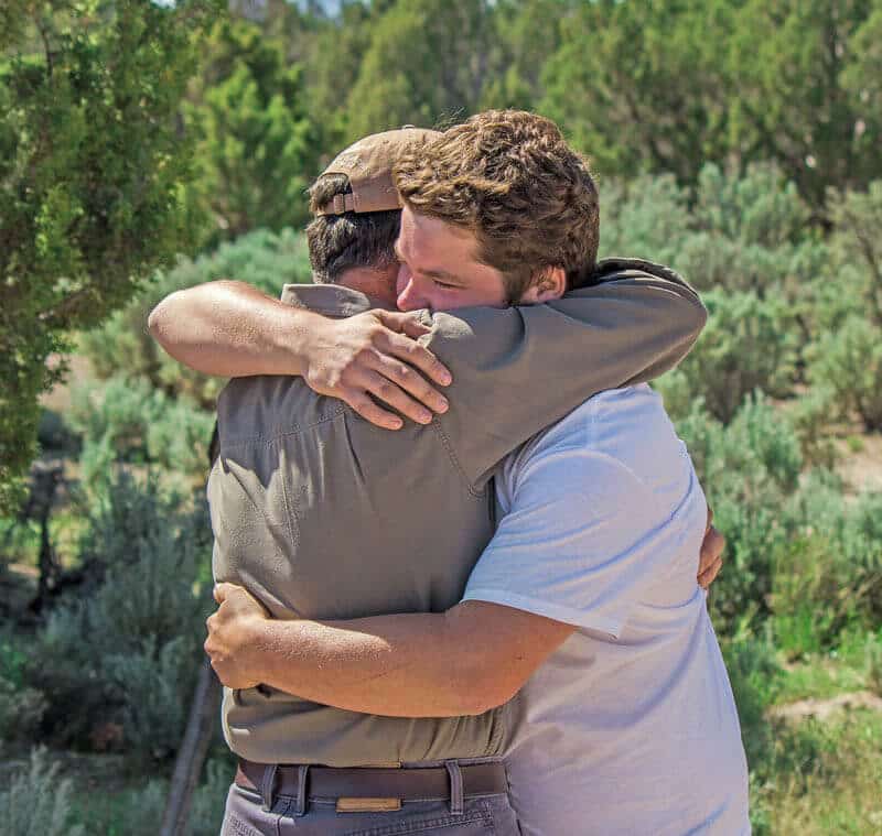 father-hugging-kid-from-wilderness-therapy