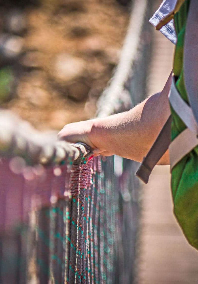 teens-out-in-nature-on-a-rope-bridge